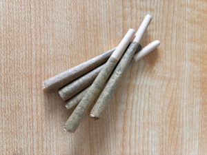 pre-rolls and joints on a table from a professional or on your own for a smooth and convenient smoking experience