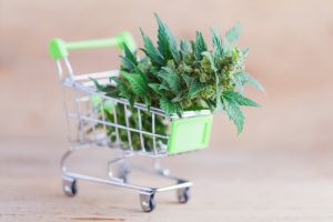 shopping cart with marijuana being bought on green wednesday with deals and discounts for holiday shopping